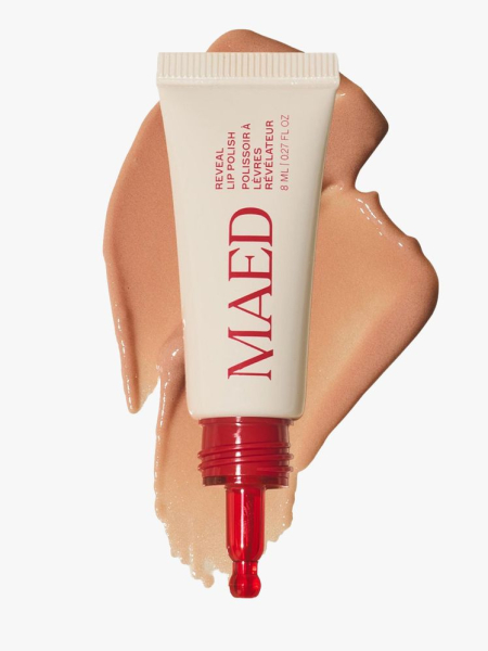 Maed Reveal Exfoliating Lip Polish cream tube with nude lip polish behind it on light gray background